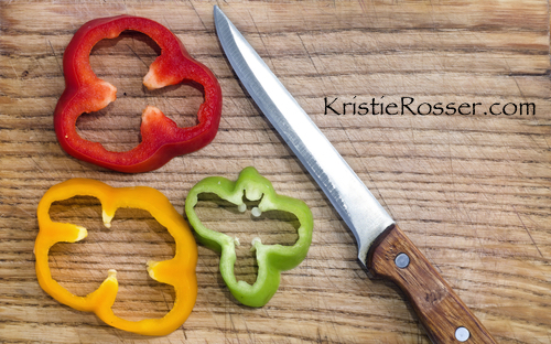 shutterstock_pepper slices knife on wood board